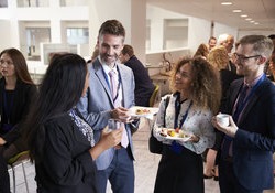 Group of people talking at a networking event