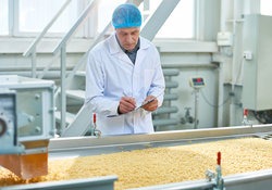 Man working on food production line