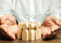 Man with wooden dolls in his hands 