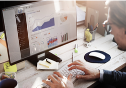 Man looking at website dashboard with figures