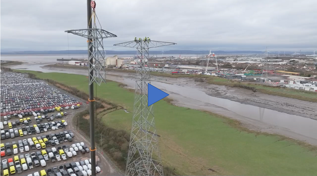Drone footage of operatives working at a height of 76 metres to construction pylons at the mouth of the River Avon